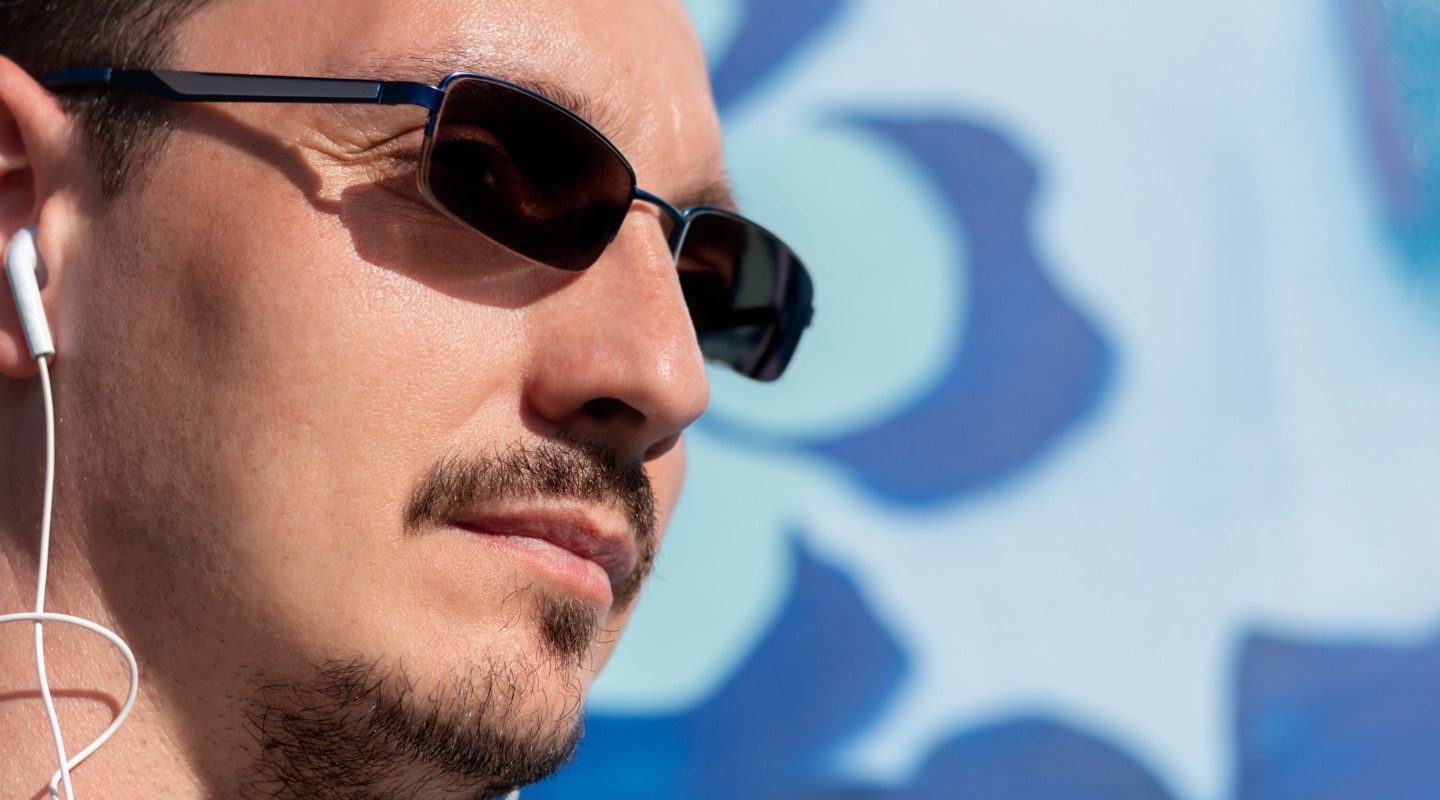 What are photochromic sunglasses and how do they work?